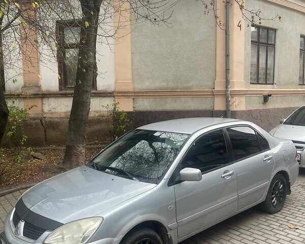 Сірий Міцубісі Lancer, об'ємом двигуна 1.58 л та пробігом 315 тис. км за 2350 $, фото 5 на Automoto.ua