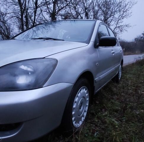 Серый Мицубиси Лансер, объемом двигателя 1.6 л и пробегом 235 тыс. км за 2850 $, фото 22 на Automoto.ua