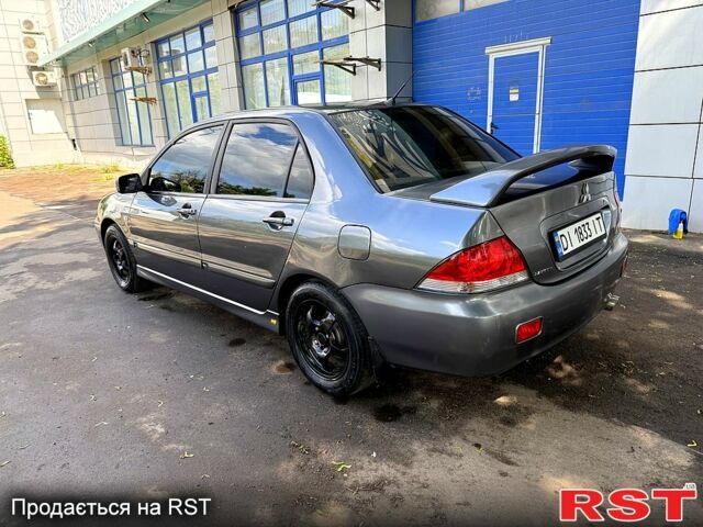 Серый Мицубиси Лансер, объемом двигателя 1.6 л и пробегом 300 тыс. км за 3850 $, фото 2 на Automoto.ua