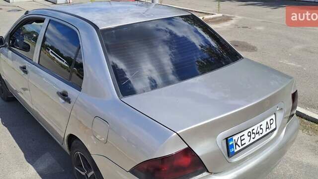 Сірий Міцубісі Lancer, об'ємом двигуна 1.3 л та пробігом 197 тис. км за 2700 $, фото 3 на Automoto.ua