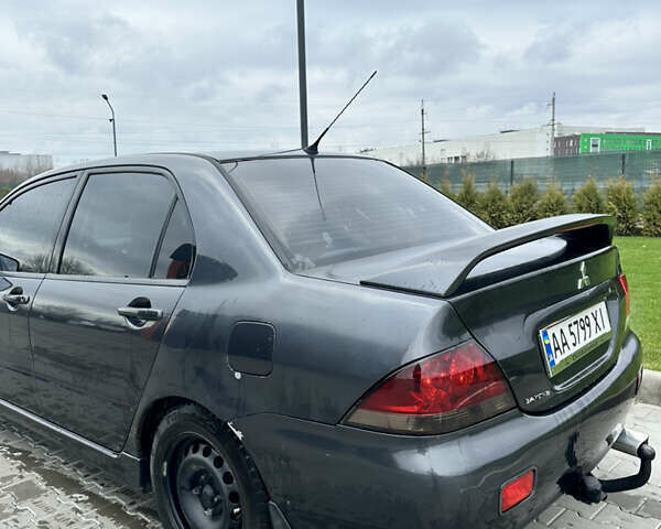 Серый Мицубиси Лансер, объемом двигателя 1.58 л и пробегом 300 тыс. км за 3500 $, фото 1 на Automoto.ua
