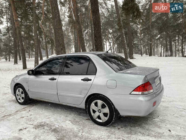 Серый Мицубиси Лансер, объемом двигателя 1.58 л и пробегом 225 тыс. км за 3950 $, фото 2 на Automoto.ua