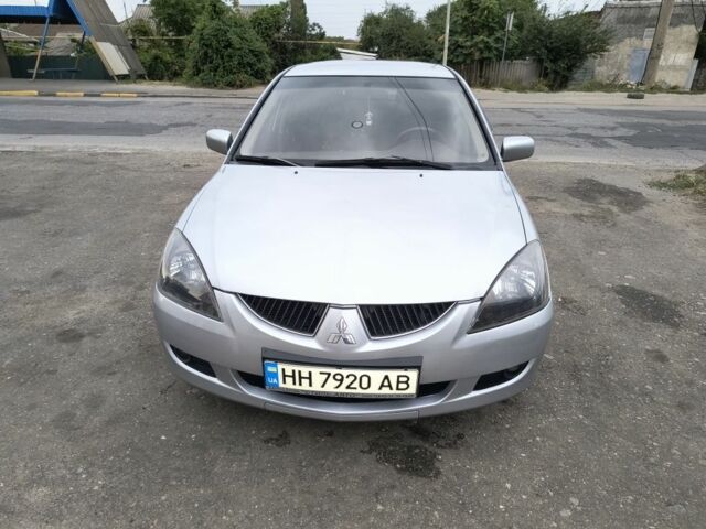 Серый Мицубиси Лансер, объемом двигателя 2 л и пробегом 212 тыс. км за 4300 $, фото 4 на Automoto.ua