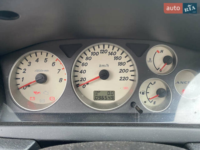 Сірий Міцубісі Lancer, об'ємом двигуна 1.58 л та пробігом 97 тис. км за 2000 $, фото 9 на Automoto.ua