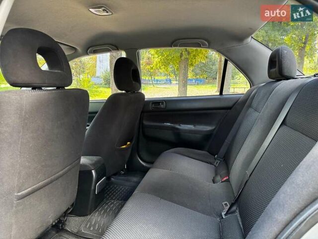 Серый Мицубиси Лансер, объемом двигателя 1.6 л и пробегом 196 тыс. км за 4490 $, фото 21 на Automoto.ua