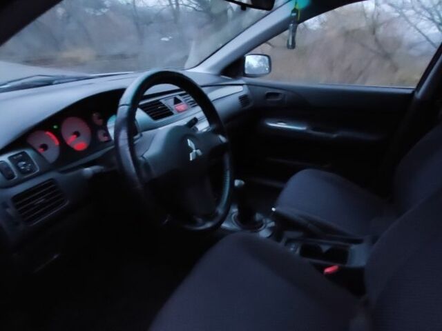 Серый Мицубиси Лансер, объемом двигателя 1.6 л и пробегом 235 тыс. км за 2850 $, фото 12 на Automoto.ua