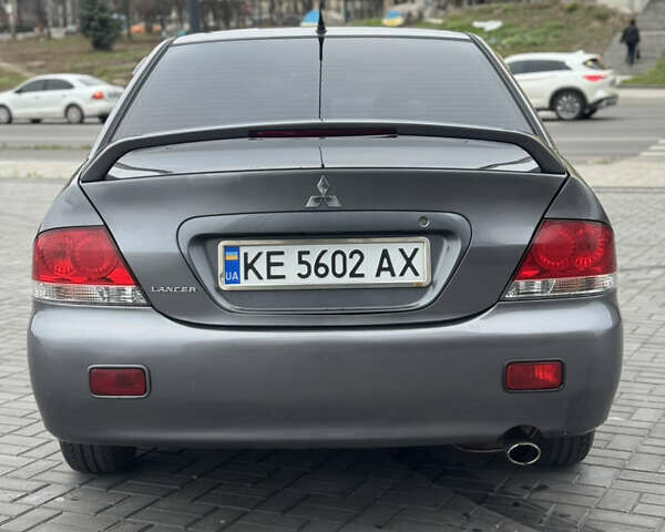 Серый Мицубиси Лансер, объемом двигателя 1.58 л и пробегом 237 тыс. км за 2999 $, фото 3 на Automoto.ua