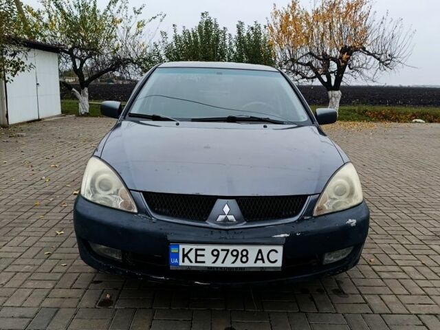 Серый Мицубиси Лансер, объемом двигателя 1.6 л и пробегом 100 тыс. км за 3500 $, фото 1 на Automoto.ua