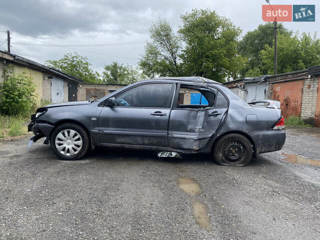 Сірий Міцубісі Lancer, об'ємом двигуна 1.58 л та пробігом 97 тис. км за 2000 $, фото 1 на Automoto.ua