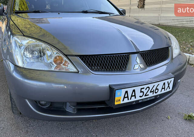 Серый Мицубиси Лансер, объемом двигателя 1.58 л и пробегом 290 тыс. км за 4450 $, фото 10 на Automoto.ua