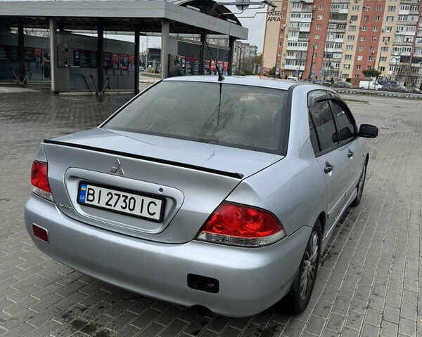 Серый Мицубиси Лансер, объемом двигателя 1.58 л и пробегом 260 тыс. км за 3500 $, фото 3 на Automoto.ua