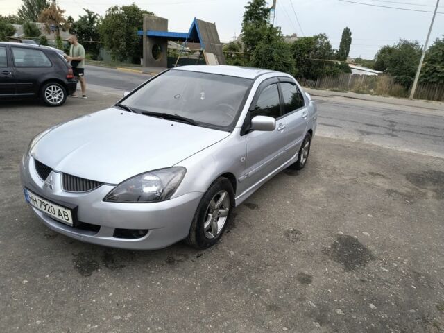 Серый Мицубиси Лансер, объемом двигателя 2 л и пробегом 212 тыс. км за 4300 $, фото 2 на Automoto.ua