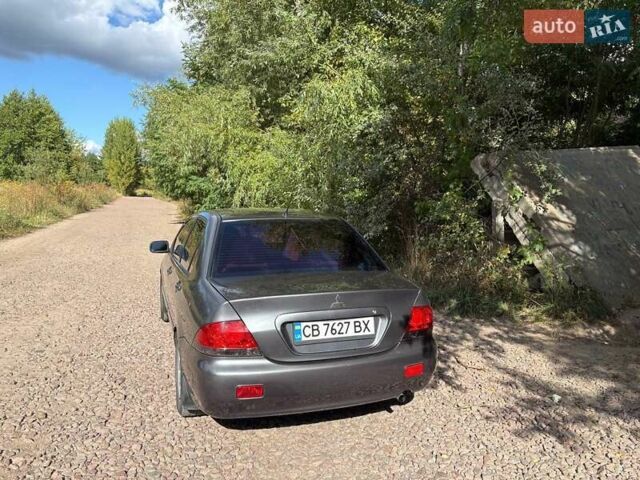 Серый Мицубиси Лансер, объемом двигателя 1.58 л и пробегом 240 тыс. км за 4200 $, фото 3 на Automoto.ua