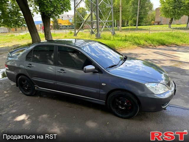 Серый Мицубиси Лансер, объемом двигателя 1.6 л и пробегом 300 тыс. км за 3850 $, фото 5 на Automoto.ua