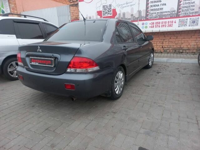Серый Мицубиси Лансер, объемом двигателя 1.6 л и пробегом 162 тыс. км за 4650 $, фото 3 на Automoto.ua