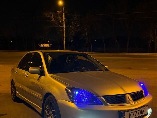 Серый Мицубиси Лансер, объемом двигателя 2 л и пробегом 256 тыс. км за 7000 $, фото 10 на Automoto.ua