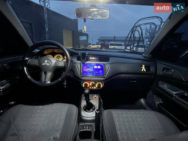 Серый Мицубиси Лансер, объемом двигателя 1.6 л и пробегом 213 тыс. км за 4500 $, фото 6 на Automoto.ua