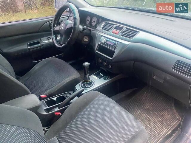 Сірий Міцубісі Lancer, об'ємом двигуна 1.58 л та пробігом 238 тис. км за 5000 $, фото 2 на Automoto.ua