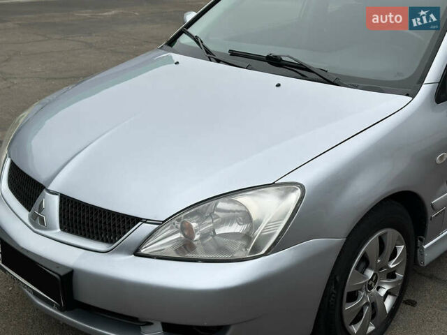 Серый Мицубиси Лансер, объемом двигателя 1.58 л и пробегом 183 тыс. км за 4800 $, фото 2 на Automoto.ua