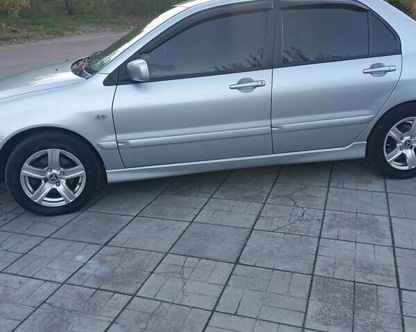 Мицубиси Лансер 2006 в Каменское - Днепродзержинск на Automoto.ua Серый Мицубиси Лансер, объемом двигателя 1.58 л и пробегом 238 тыс. км за 5400 $, фото 5 на Automoto.ua