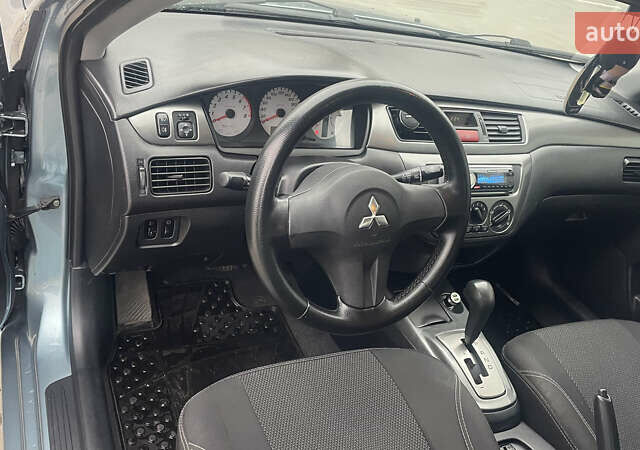 Сірий Міцубісі Lancer, об'ємом двигуна 1.58 л та пробігом 267 тис. км за 5300 $, фото 6 на Automoto.ua