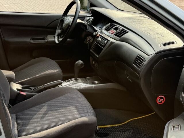 Серый Мицубиси Лансер, объемом двигателя 1.6 л и пробегом 220 тыс. км за 4400 $, фото 11 на Automoto.ua