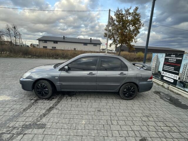 Серый Мицубиси Лансер, объемом двигателя 1.6 л и пробегом 213 тыс. км за 4450 $, фото 6 на Automoto.ua