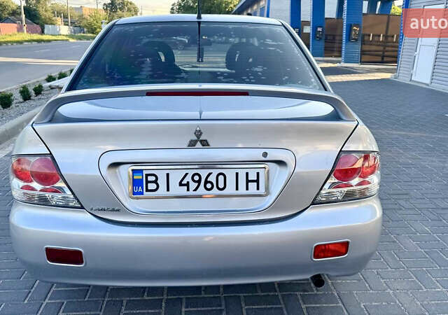Сірий Міцубісі Lancer, об'ємом двигуна 1.6 л та пробігом 263 тис. км за 4900 $, фото 3 на Automoto.ua
