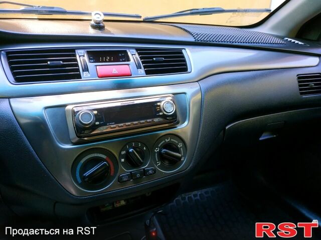 Серый Мицубиси Лансер, объемом двигателя 1.6 л и пробегом 177 тыс. км за 4000 $, фото 7 на Automoto.ua