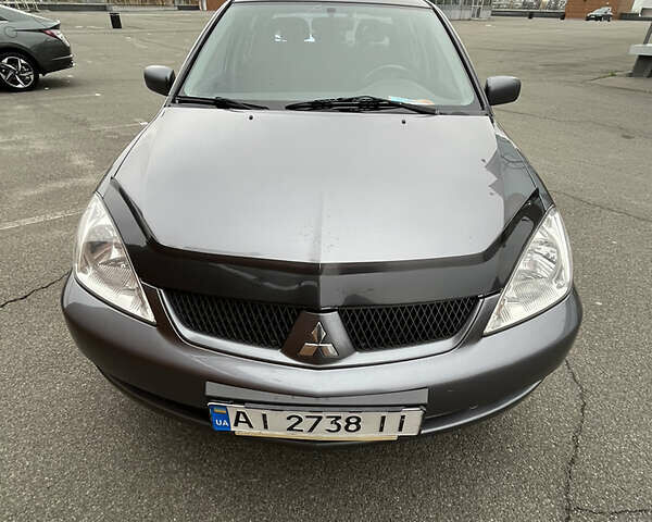 Сірий Міцубісі Lancer, об'ємом двигуна 1.6 л та пробігом 260 тис. км за 4998 $, фото 30 на Automoto.ua