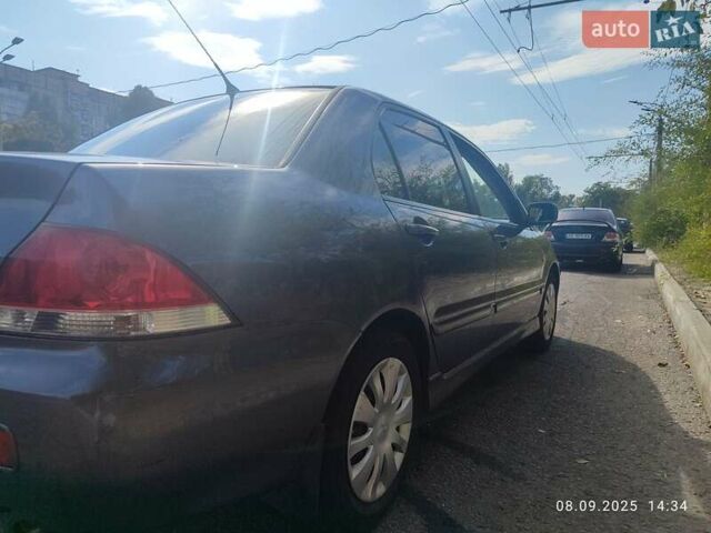 Сірий Міцубісі Lancer, об'ємом двигуна 1.6 л та пробігом 242 тис. км за 4900 $, фото 9 на Automoto.ua