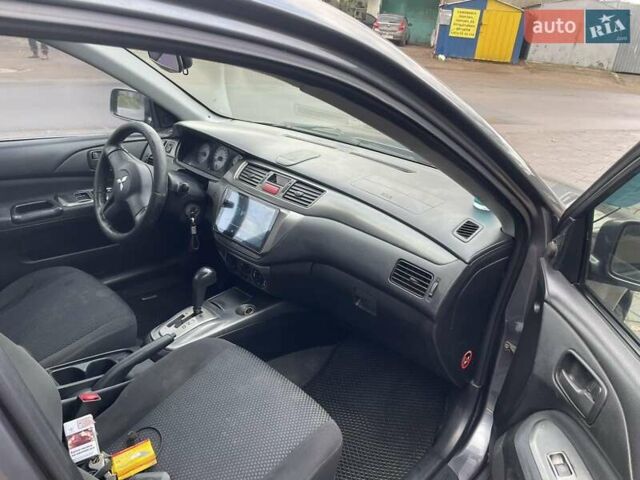 Сірий Міцубісі Lancer, об'ємом двигуна 1.6 л та пробігом 262 тис. км за 4400 $, фото 9 на Automoto.ua