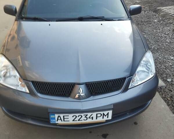 Сірий Міцубісі Lancer, об'ємом двигуна 1.58 л та пробігом 217 тис. км за 3500 $, фото 13 на Automoto.ua