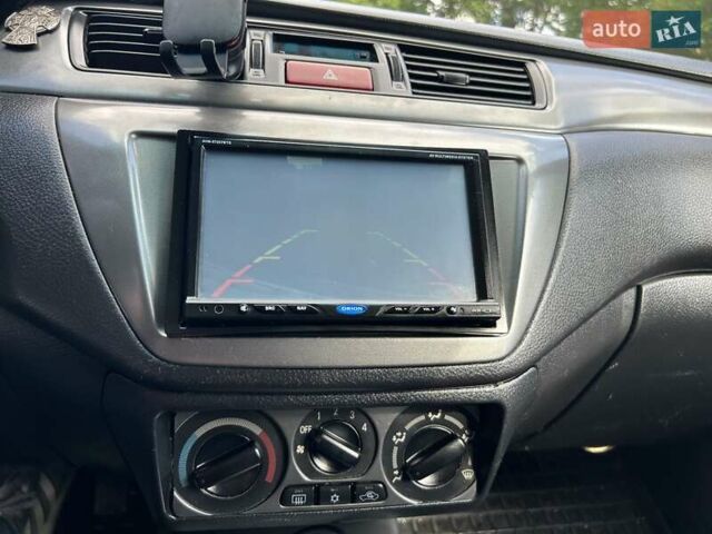 Сірий Міцубісі Lancer, об'ємом двигуна 1.58 л та пробігом 160 тис. км за 4600 $, фото 15 на Automoto.ua