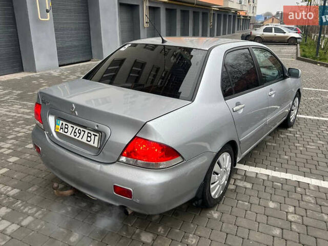 Сірий Міцубісі Lancer, об'ємом двигуна 1.58 л та пробігом 333 тис. км за 2999 $, фото 7 на Automoto.ua