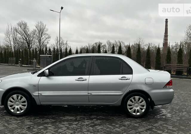 Сірий Міцубісі Lancer, об'ємом двигуна 1.6 л та пробігом 170 тис. км за 4200 $, фото 5 на Automoto.ua