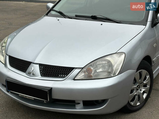 Серый Мицубиси Лансер, объемом двигателя 1.58 л и пробегом 183 тыс. км за 4800 $, фото 4 на Automoto.ua