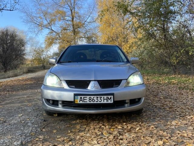 Серый Мицубиси Лансер, объемом двигателя 1.6 л и пробегом 204 тыс. км за 3999 $, фото 1 на Automoto.ua
