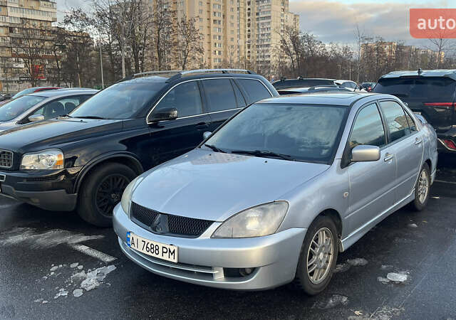 Серый Мицубиси Лансер, объемом двигателя 2 л и пробегом 307 тыс. км за 3999 $, фото 7 на Automoto.ua