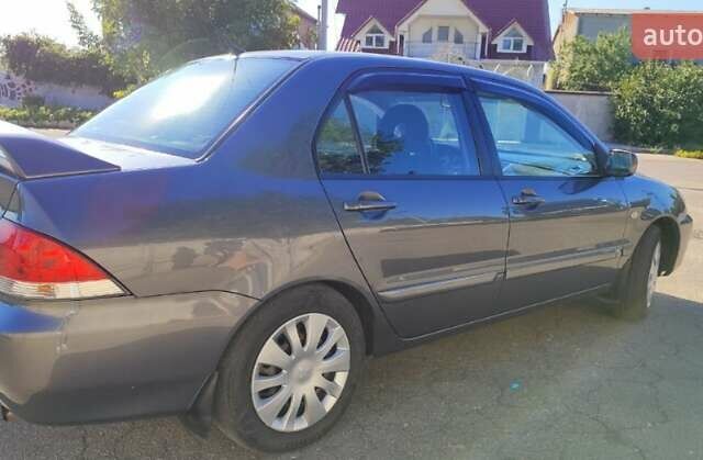 Сірий Міцубісі Lancer, об'ємом двигуна 1.6 л та пробігом 229 тис. км за 4900 $, фото 18 на Automoto.ua