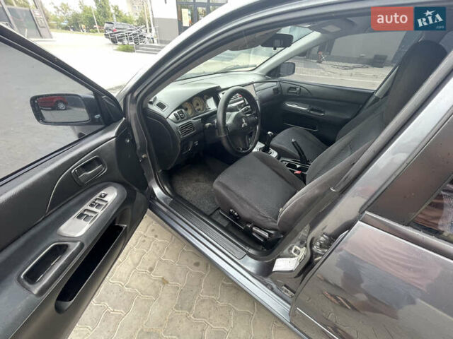 Сірий Міцубісі Lancer, об'ємом двигуна 1.58 л та пробігом 162 тис. км за 4650 $, фото 17 на Automoto.ua