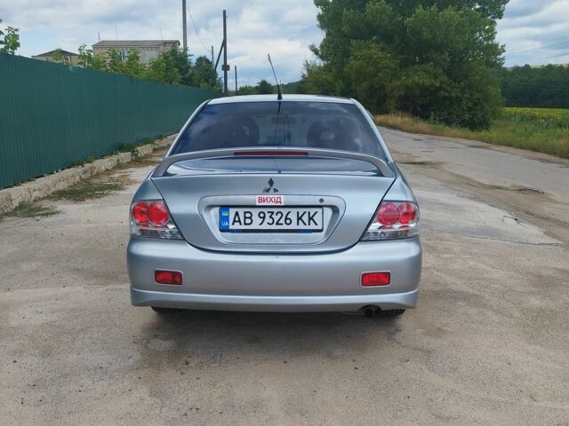 Серый Мицубиси Лансер, объемом двигателя 2 л и пробегом 306 тыс. км за 4100 $, фото 4 на Automoto.ua