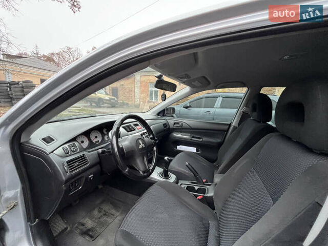 Сірий Міцубісі Lancer, об'ємом двигуна 1.58 л та пробігом 308 тис. км за 3700 $, фото 12 на Automoto.ua