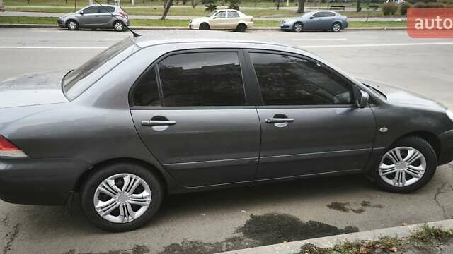 Серый Мицубиси Лансер, объемом двигателя 1.6 л и пробегом 263 тыс. км за 3650 $, фото 9 на Automoto.ua