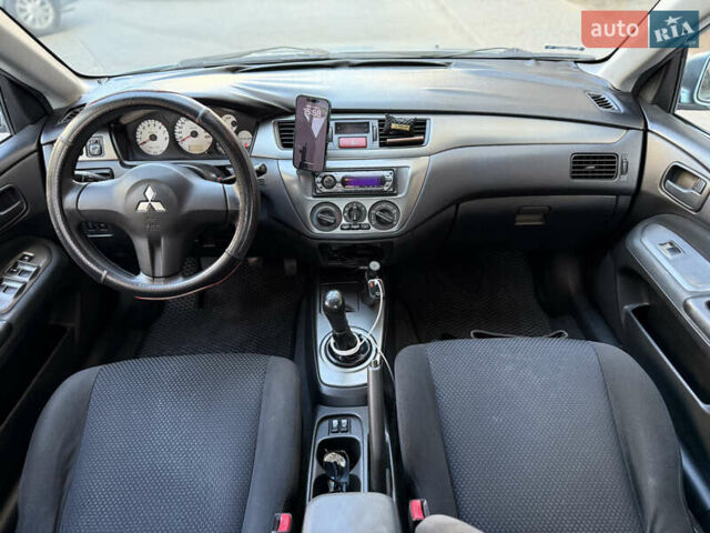 Сірий Міцубісі Lancer, об'ємом двигуна 1.6 л та пробігом 152 тис. км за 3800 $, фото 7 на Automoto.ua