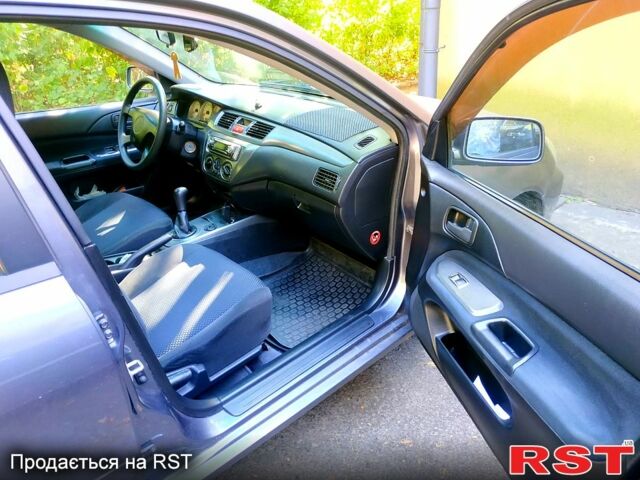 Серый Мицубиси Лансер, объемом двигателя 1.6 л и пробегом 177 тыс. км за 4000 $, фото 3 на Automoto.ua