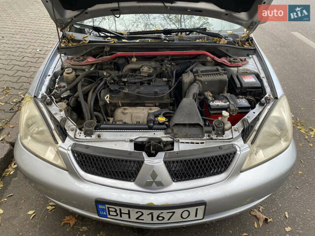Серый Мицубиси Лансер, объемом двигателя 1.6 л и пробегом 444 тыс. км за 3400 $, фото 7 на Automoto.ua