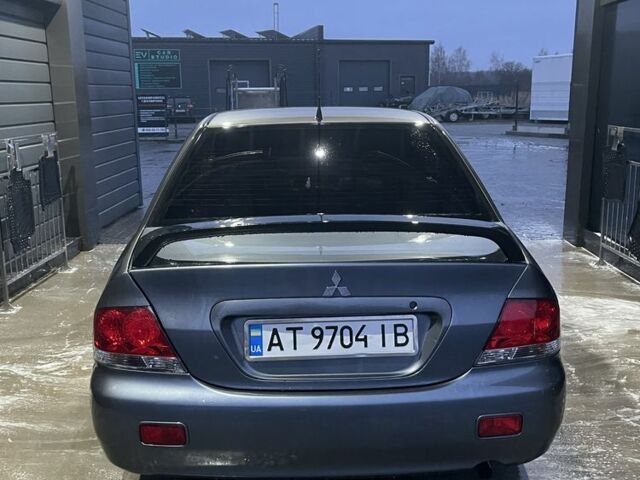 Серый Мицубиси Лансер, объемом двигателя 1.6 л и пробегом 213 тыс. км за 4450 $, фото 2 на Automoto.ua