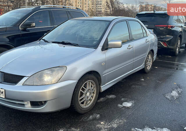 Серый Мицубиси Лансер, объемом двигателя 2 л и пробегом 307 тыс. км за 3999 $, фото 6 на Automoto.ua