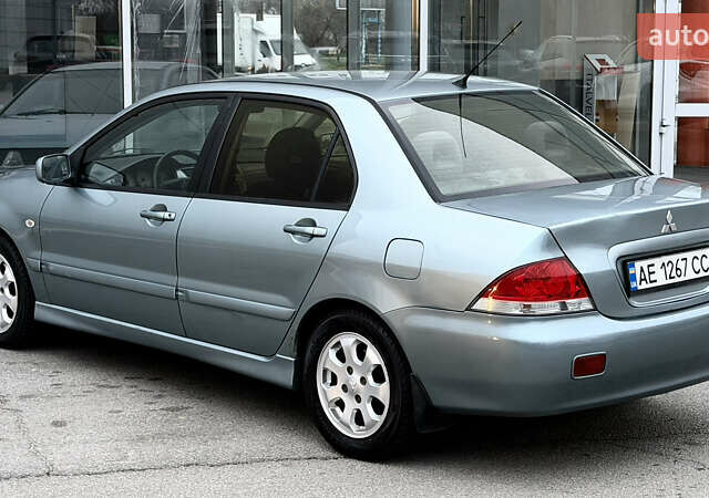 Сірий Міцубісі Lancer, об'ємом двигуна 1.58 л та пробігом 275 тис. км за 4600 $, фото 1 на Automoto.ua